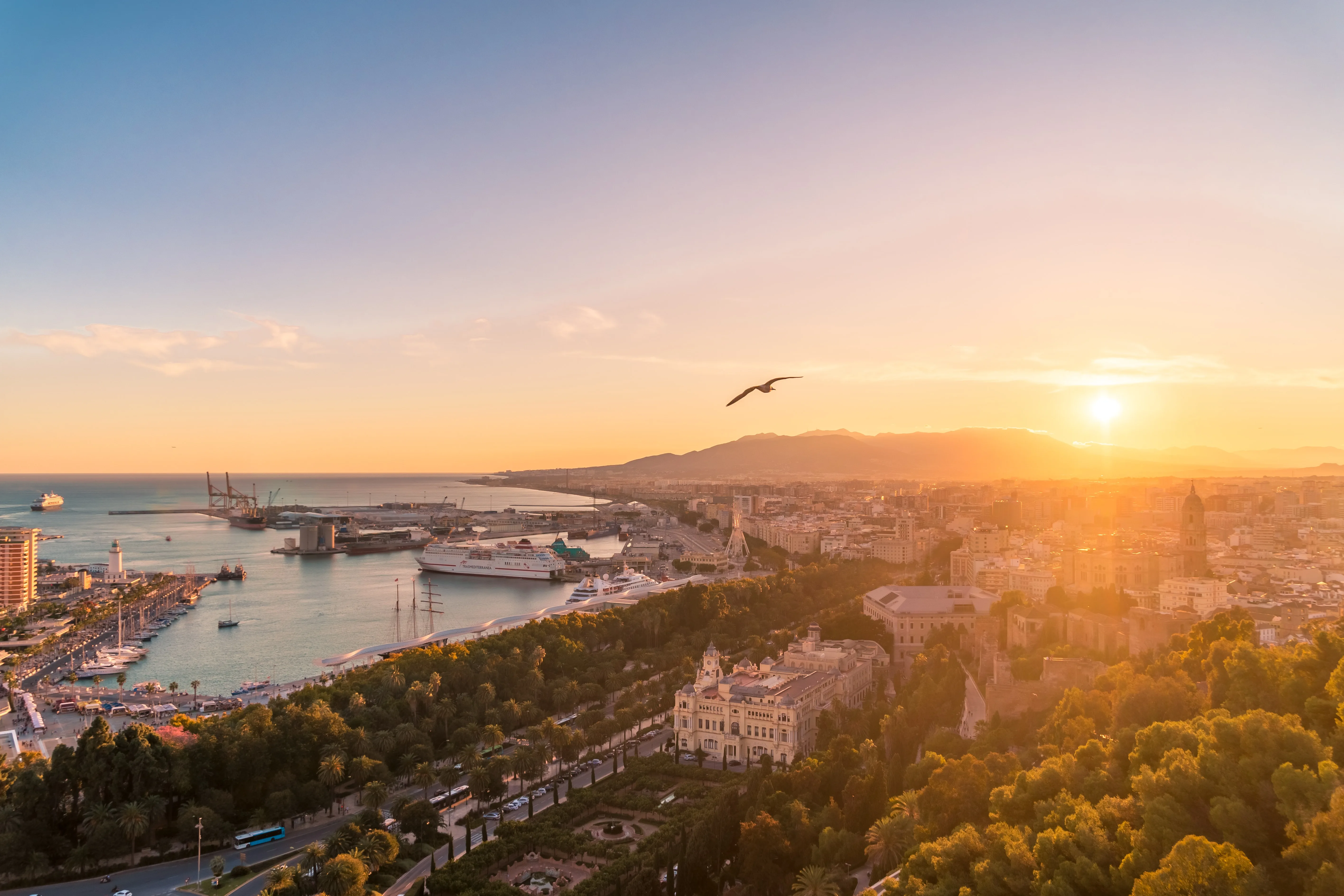 Málaga at golden hour: the port, the old town and the Costa del Sol