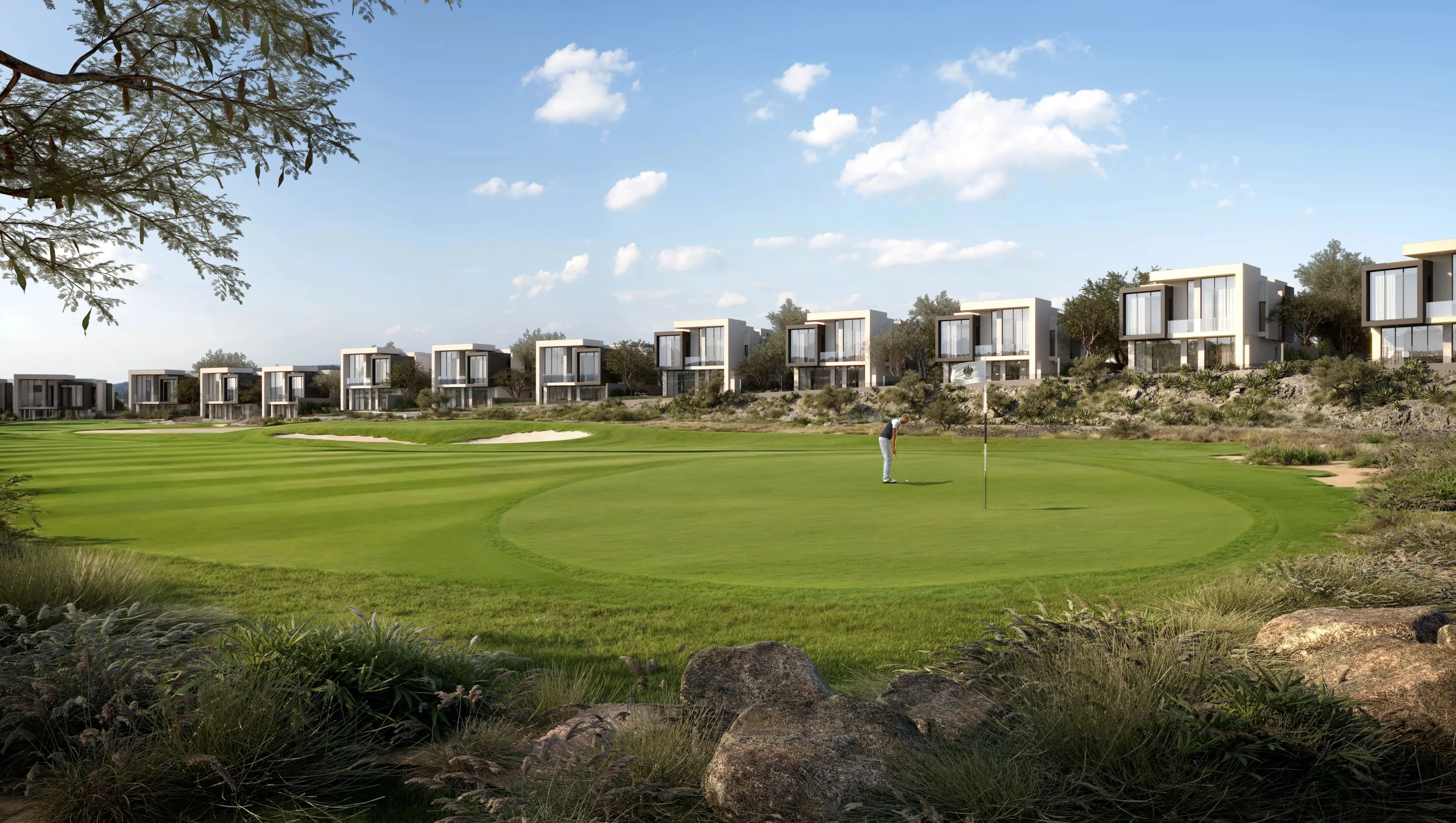 Modern villas beside a golf course green