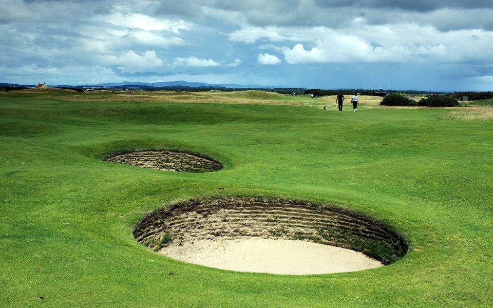 Deep pot bunkers on a links fairway