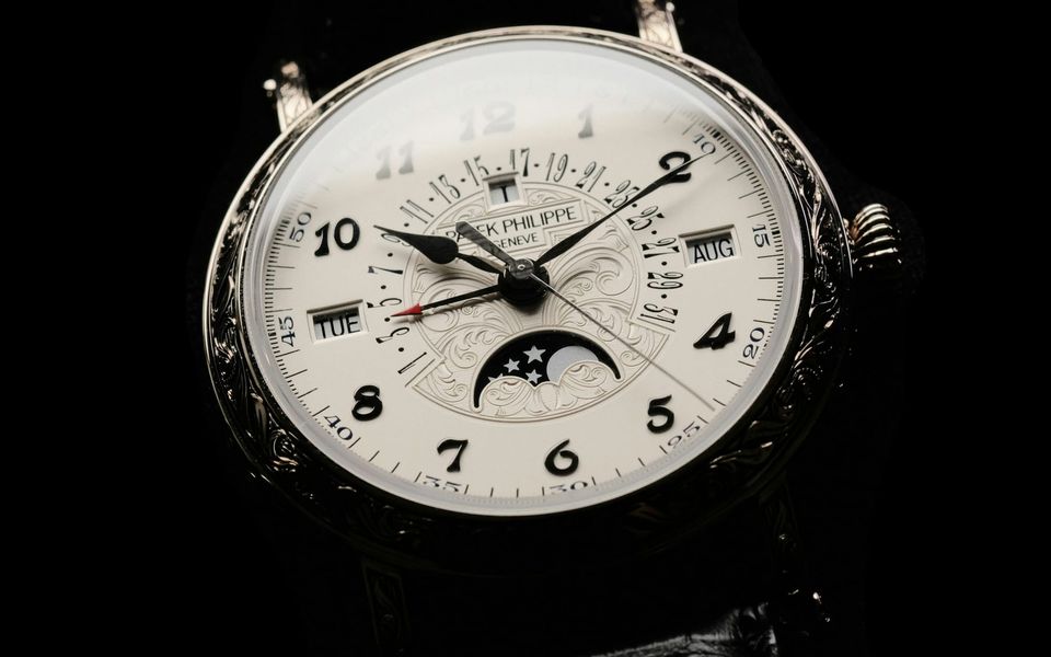 A Patek Philippe perpetual calendar with a moon-phase dial