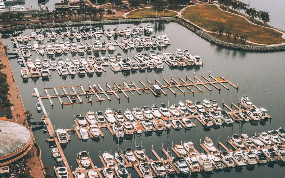 Aerial view of yachts berthed across a large marina