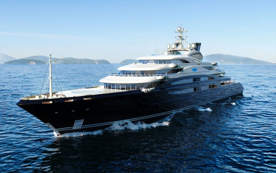 A dark-hulled superyacht under way off a rocky coast
