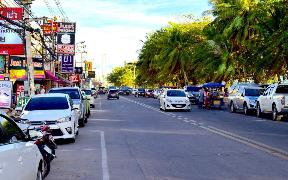 Jomtien Beach Road lined with palms and shops, Pattaya