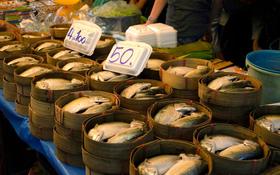 Steamed mackerel in bamboo baskets on a Thai market stall