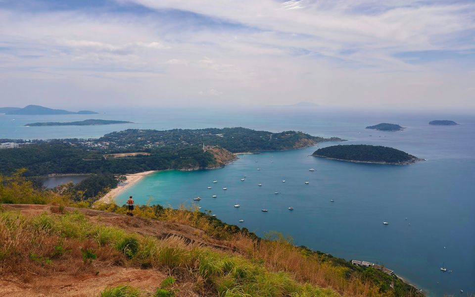 Nai Harn Beach and Nai Harn Lake from the hills, with yachts at anchor and Koh Man offshore